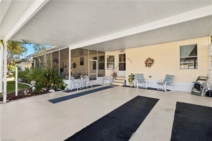 View of patio with a carport