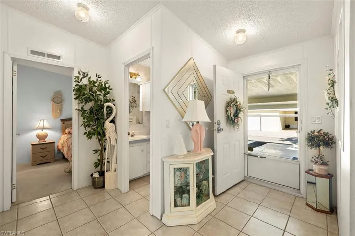Nice size entry foyer with glass door for sunlight