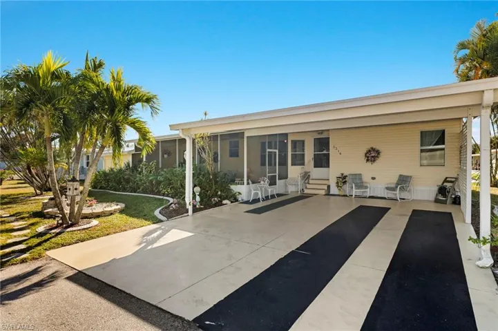 Great double carport that has a large screened lanai attached.