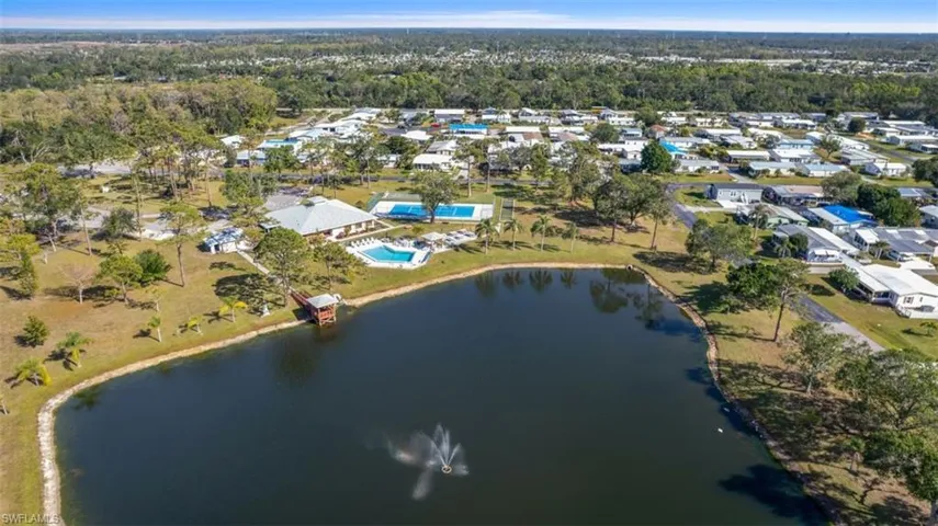 Birds eye view of property featuring the water view
