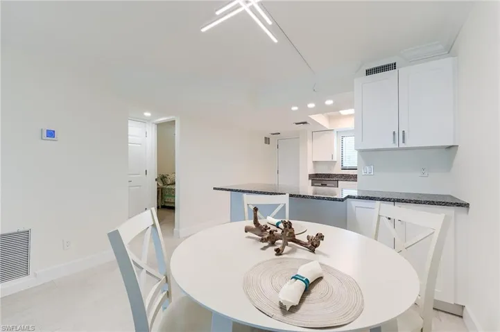 Dining room featuring ornamental molding and recessed lighting