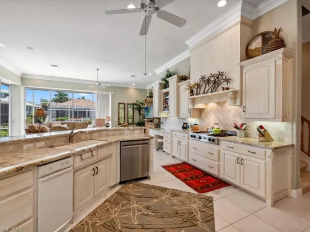 Kitchen featuring stainless steel appliances, ceiling fan, tasteful backsplash, light tile patterned flooring, and open shelves