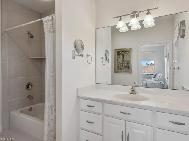 Full bath with shower / bathtub combination with curtain and vanity