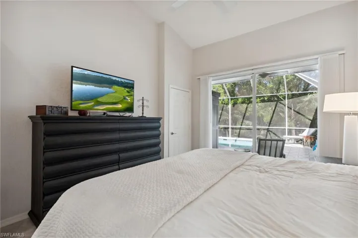 PRIMARY BEDROOM SUITE WITH ENTRY TO POOL AREA...