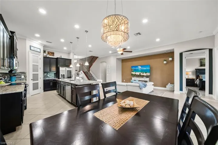 Dining space crown moldingtile patterned flooring