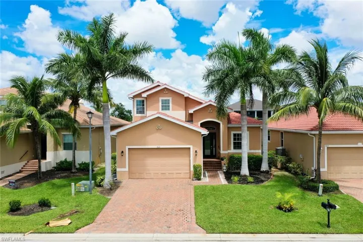 Mediterranean / spanish-style house featuring a front yard, a garage, and new Tile roof