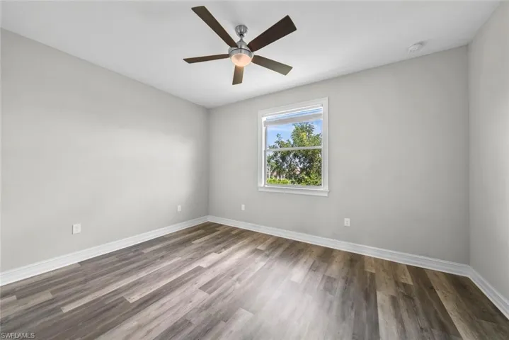 2nd Floor bedroom with ceiling fan and dark hardwood / wood-style floors