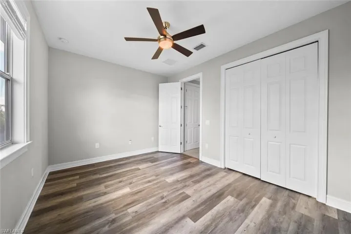 2nd floor bedroom with  hardwood / wood-style flooring, ceiling fan, and a closet