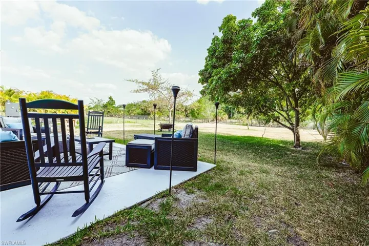 View of yard with an outdoor living space and a patio area