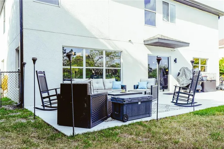 Rear view of house featuring a patio
