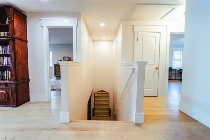 Hall featuring an upstairs landing