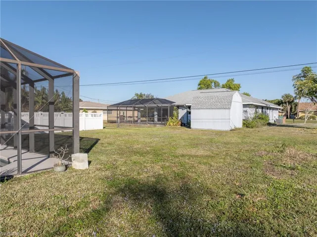View of yard with a lanai and a patio area