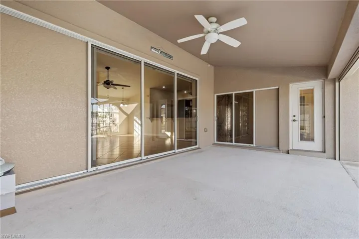 View of lanai featuring ceiling fan and sliders to living and kitchen breakfast area