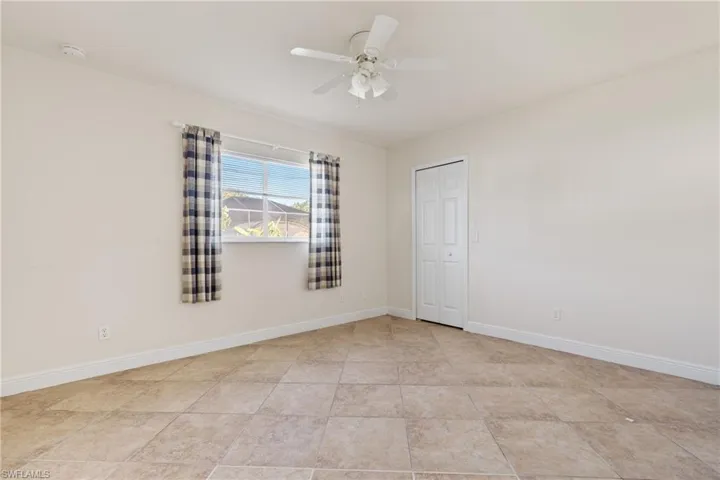 Guest bedroom #1  featuring ceiling fan
