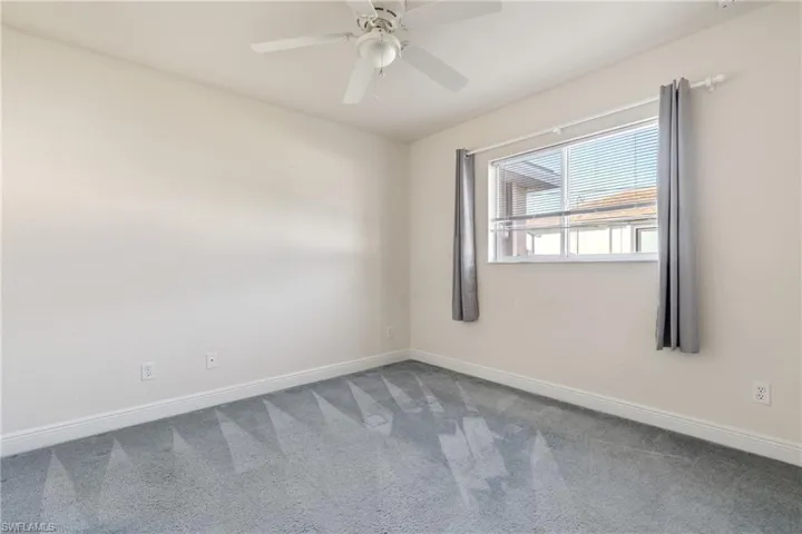 Guest bedroom #2 featuring ceiling fan