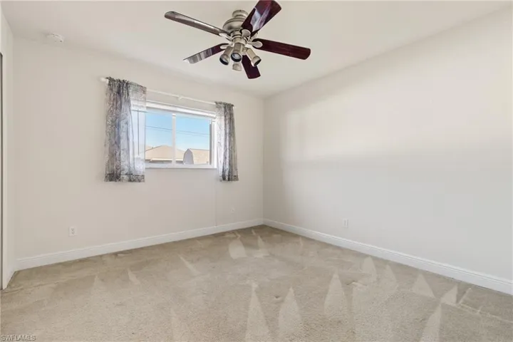 Guest bedroom #3 with ceiling fan