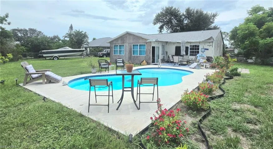 In-ground pool w/spacious .49 acres Fenced property