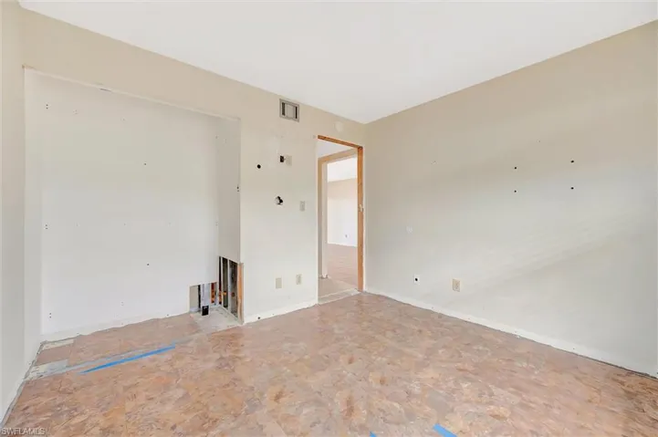 Empty room with baseboards