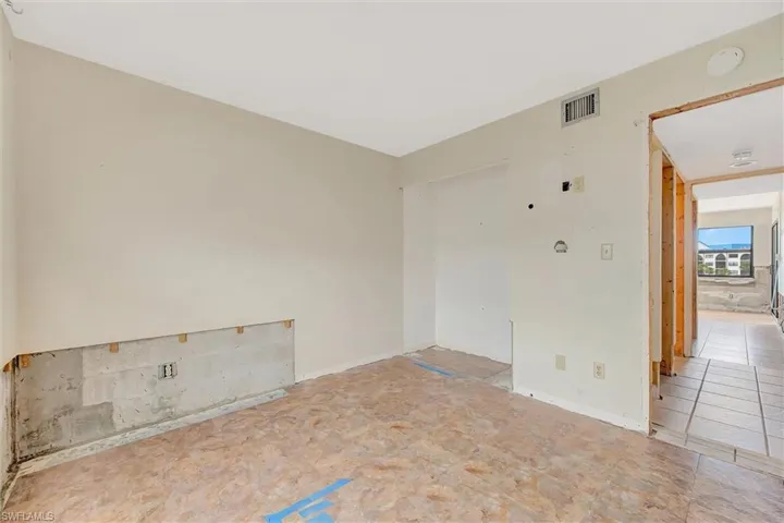 Unfurnished room featuring baseboards