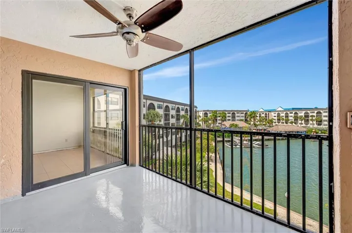 Unfurnished sunroom featuring a water view