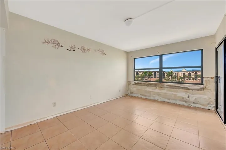 Spare room featuring light tile patterned floors