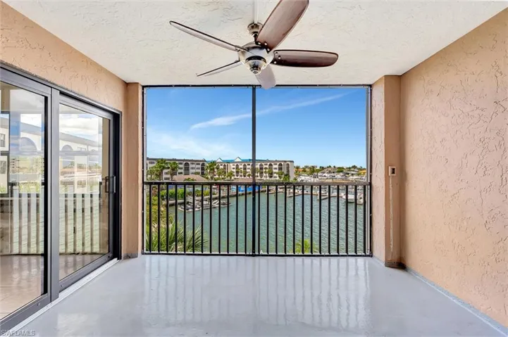 Unfurnished sunroom with a water view