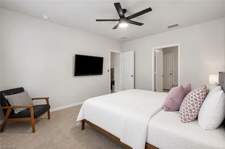 Carpeted flooring, recessed lighting, and a ceiling fan with integrated light fixtureEdited with AI.
