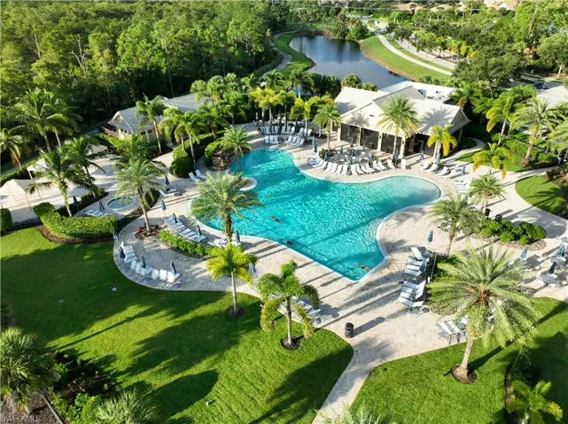 Community pool featuring a patio and a water view