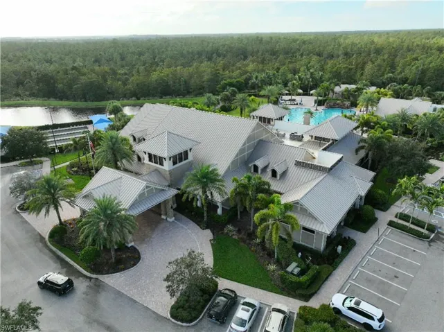 Aerial view of a heavily wooded area and a pool area