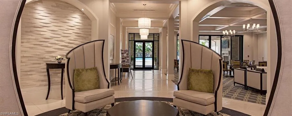 Community lobby featuring coffered ceiling and beam ceiling