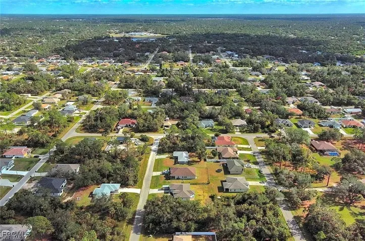 Aerial overview of property's location with nearby suburban area