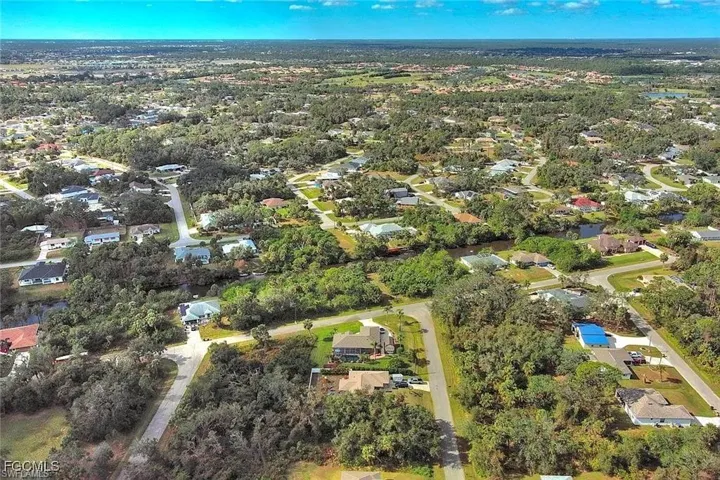 Aerial overview of property's location with nearby suburban area
