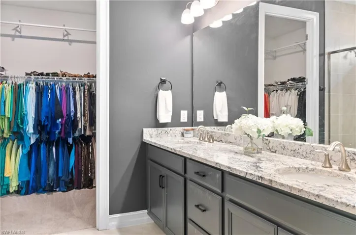 Double vanity with granite-style countertop and dual undermount sinks