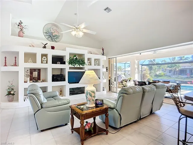 VIEW OF THE OPEN AREA OF LIVING ROOM WITH OPEN SLIDERS TO OUTDOORS