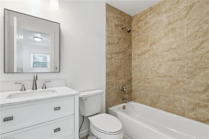 Bathroom featuring bathing tub / shower combination and vanity