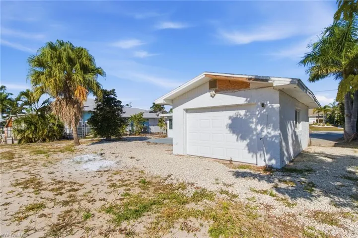 Garage featuring driveway