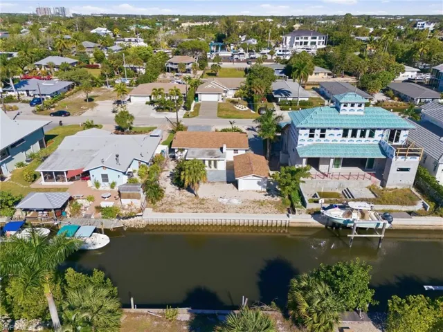Aerial view of residential area with a large body of water