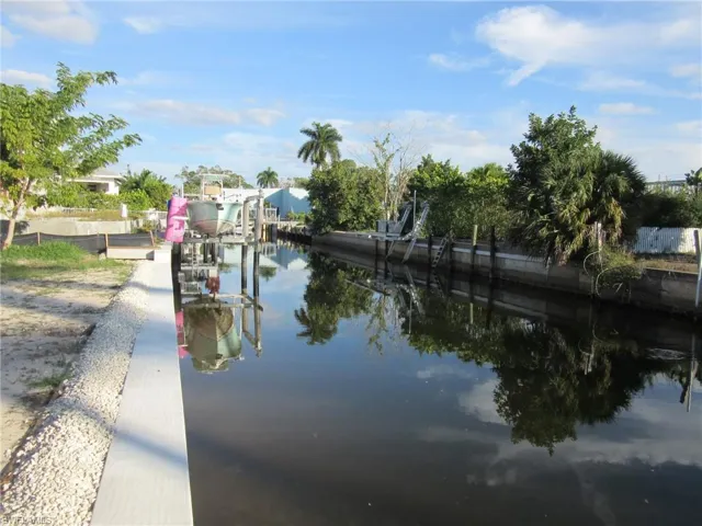 Water view with a boat dock and boat lift