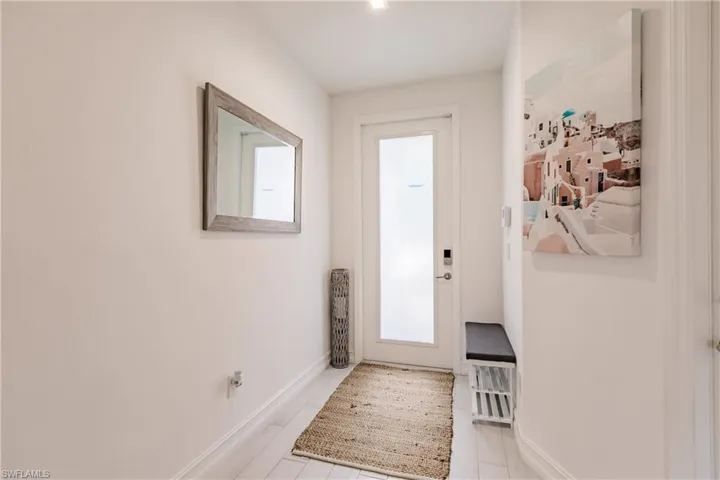 Entryway with light tile floors