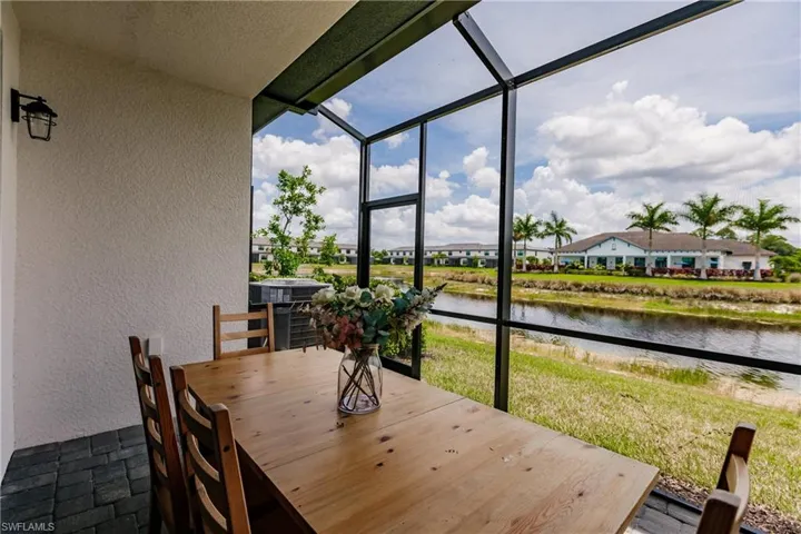 Sunroom / solarium with a water view