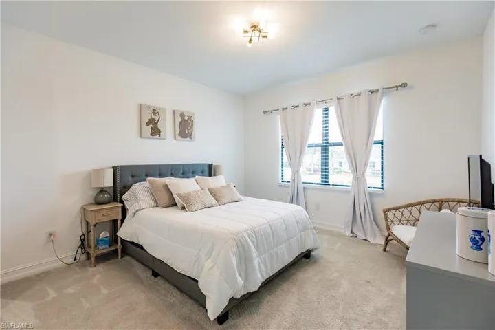 Bedroom featuring carpet flooring