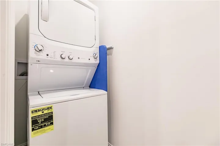 Laundry area with stacked washer and dryer and hookup for a washing machine