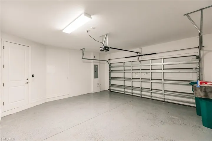 Garage featuring a garage door opener