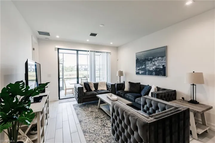 Living room with light wood-type flooring