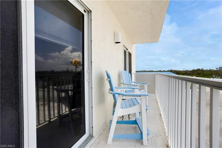 sliders from guest bedroom to open balcony.