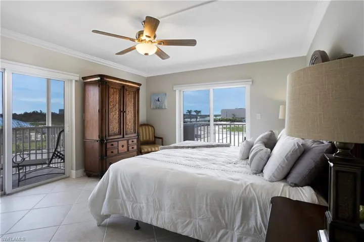 Primary bedroom with bay and island views-sliders out to 2 balconies!!!