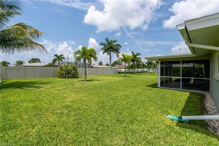 View of yard featuring a sunroom