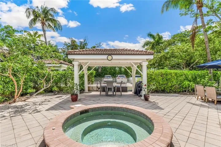 View of pool featuring an in ground hot tub, a patio area, and a gazebo