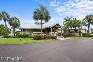 Single story home featuring a front lawn
