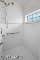 Bathroom featuring tiled shower